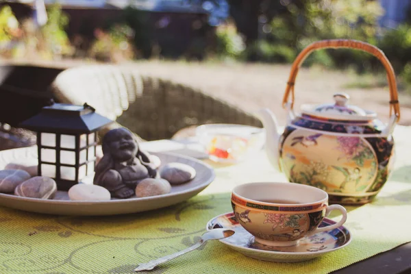 Tea party in chinese style in the summer garden