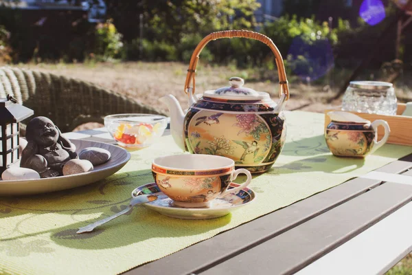 Tea party in chinese style in the summer garden