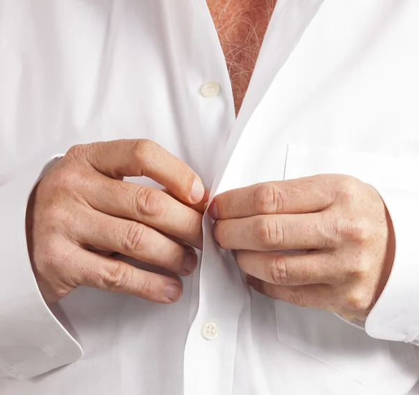 Man closing his shirt — Stock Photo, Image