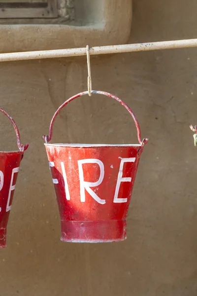 Red fire buckets filled with sand — Stock Photo, Image