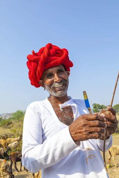 A Rajasthani tribal man wearing traditional colorful turban and — Stock Photo, Image