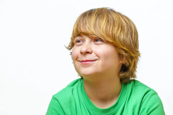 Smiling boy sitting on a sofa — Stock Photo, Image