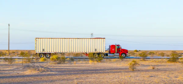 Truck on highway 8 in sunrise — Stock Photo, Image