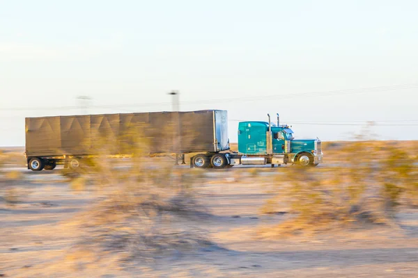 Truck on highway 8 in sunrise — Stock Photo, Image