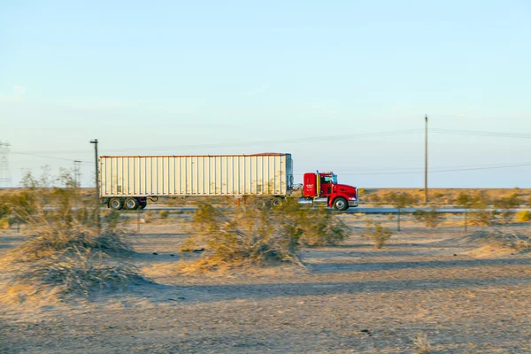 Truck on highway 8 in sunrise — Stock Photo, Image