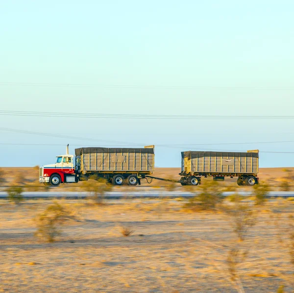 Truck on highway 8 in sunrise — Stock Photo, Image