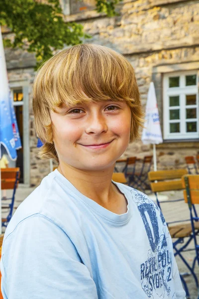 Young boy looking confident and smiles — Stock Photo, Image