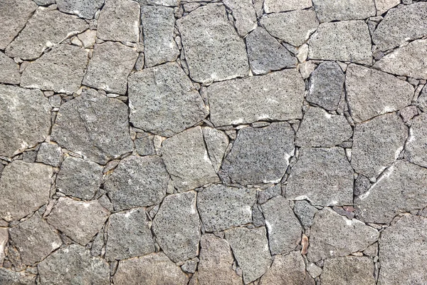 Tipico muro realizzato senza soluzione di continuità in pietra vulcanica — Foto Stock