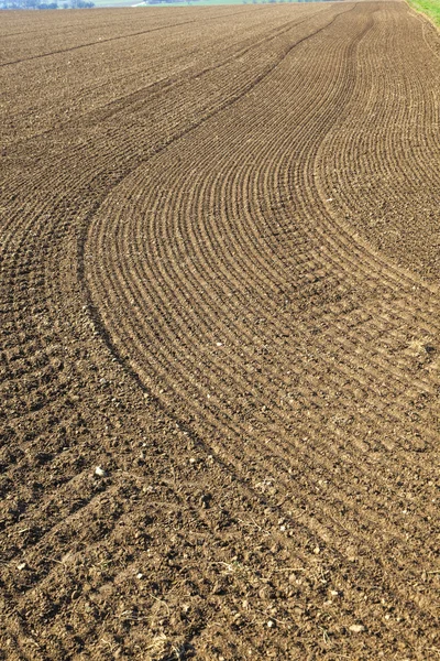 Freshly ploughed field in spring — Stock Photo, Image