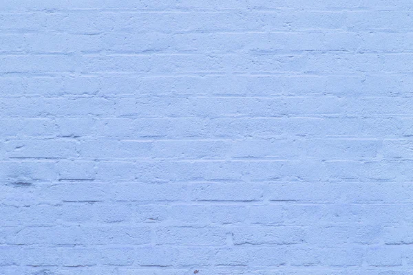 Фон с фрагментом синей кирпичной стены — стоковое фото