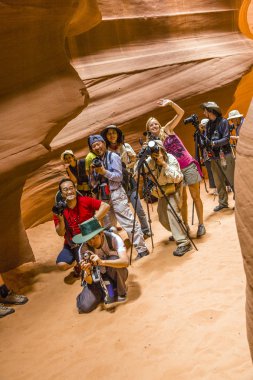 Photographers shooting of the upper Antelope Canyon clipart