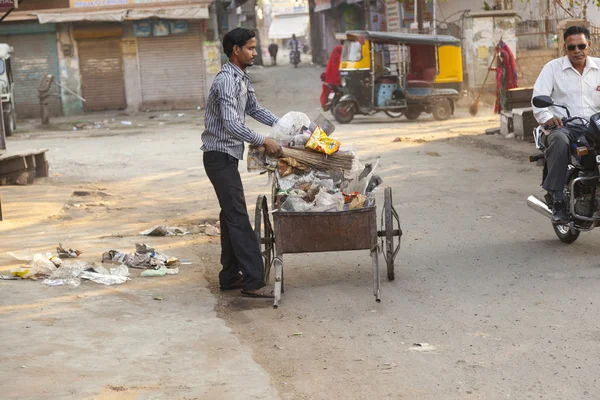 Indian man of fourt class cleans the street — Stock Photo, Image