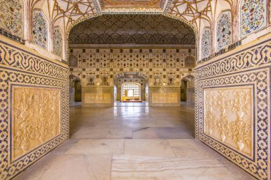 walls with silver and mirrors in rich decorated Amber fort. Jaip clipart