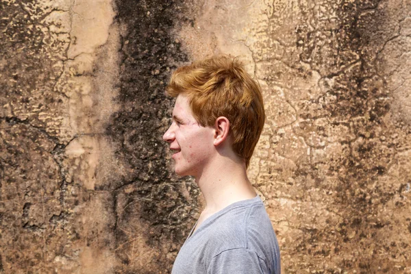 Portrait of 16 years old boy with red hair with grunge backgroun — Stock Photo, Image