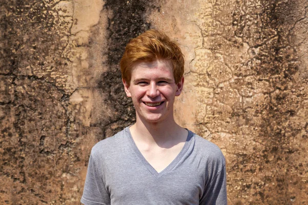 Portrait of 16 years old boy with red hair with grunge backgroun — Stock Photo, Image