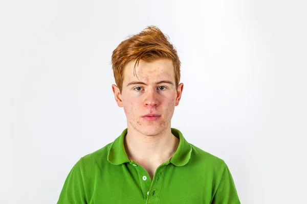 Cool boy in green shirt with red hair — Stock Photo, Image