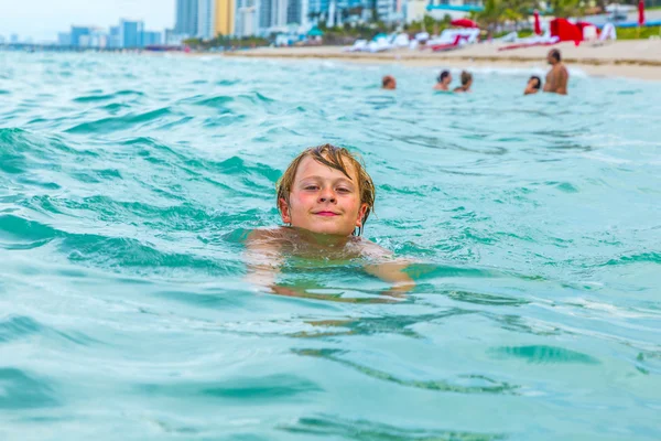 Boy is swimming in the ocean — Stock Photo, Image