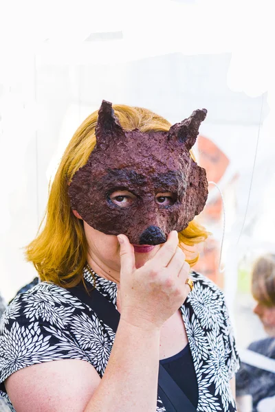 Woman under a hand made mask — Stock Photo, Image
