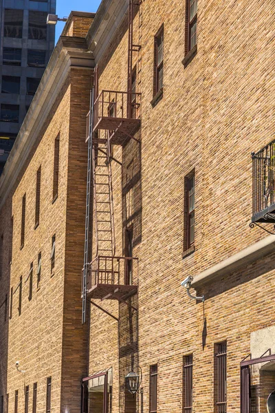 Fire ladder at an old Brick house — Stock Photo, Image