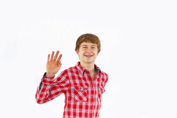 Attractive smiling boy in studio — Stock Photo, Image