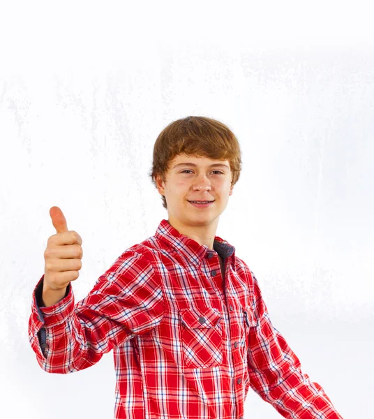 Attractive smiling boy in studio — Stock Photo, Image