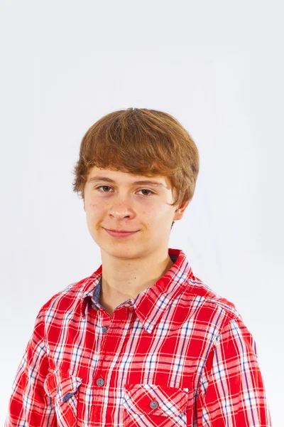 Attractive smiling boy in studio — Stock Photo, Image