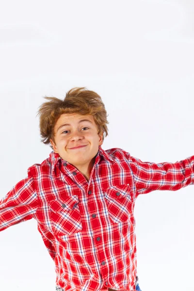 Jumping boy in studio — Stock Photo, Image