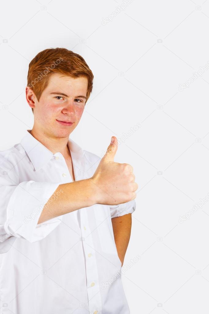 boy showing i like it sign with thumbs up