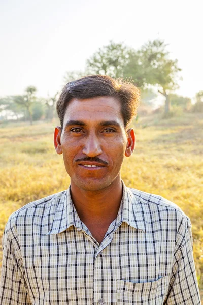 Farmer poses in front of his cows — Stock Photo, Image