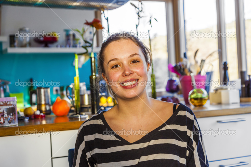 portrait of attractive girl smiling at home