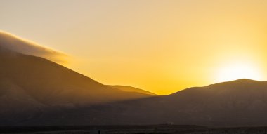 sunrise over Femes mountains seen from Playa Blanca, Lanzarote clipart