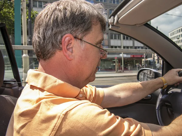 Man driving his cabrio at a sunny day — Stock Photo, Image