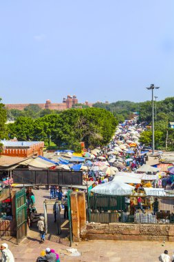 Indian bargain and buy at the Jama Mashid bazaar clipart