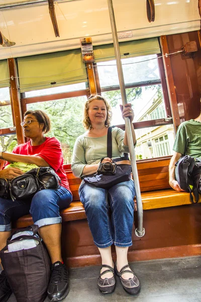 Passengers fill the seats of one of the historic green St. Charl — Stock Photo, Image