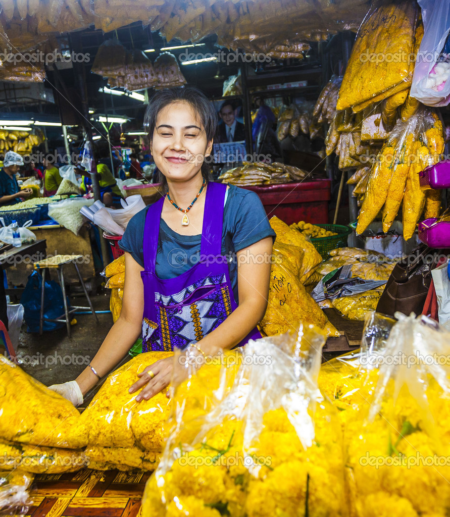 women sells fresh flowers at the morning market Stock Editorial Photo