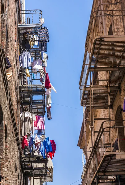 Iron fire escape is used for drying clothes — Stock Photo, Image