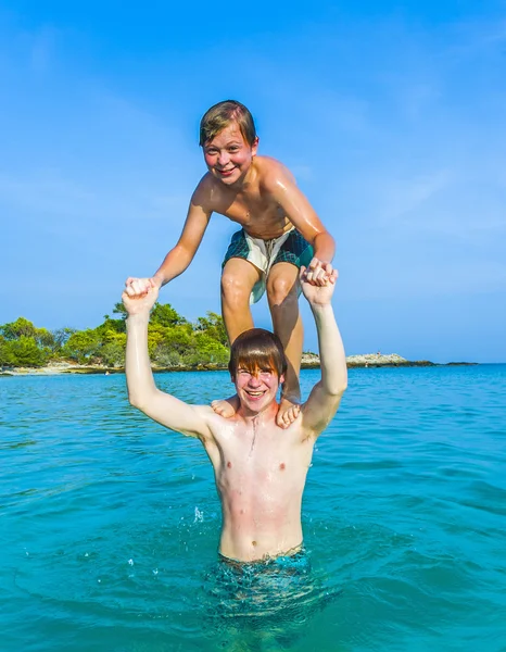 Boys have fun playing piggyback — Stock Photo, Image