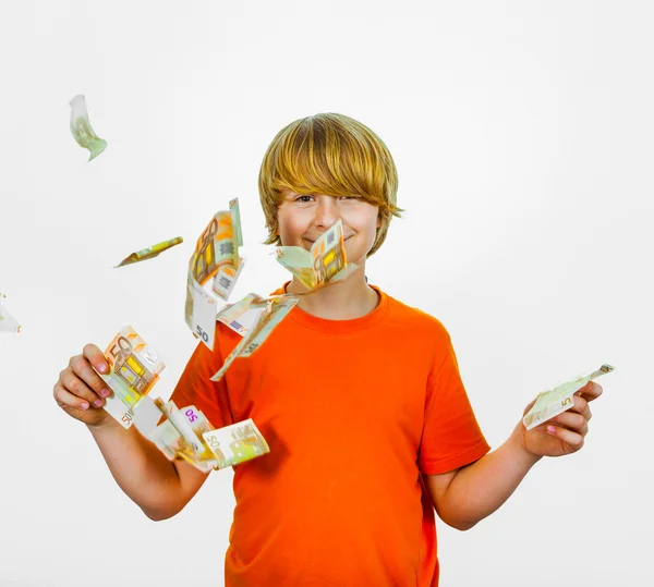 Euros flying around a boys head — Stock Photo, Image