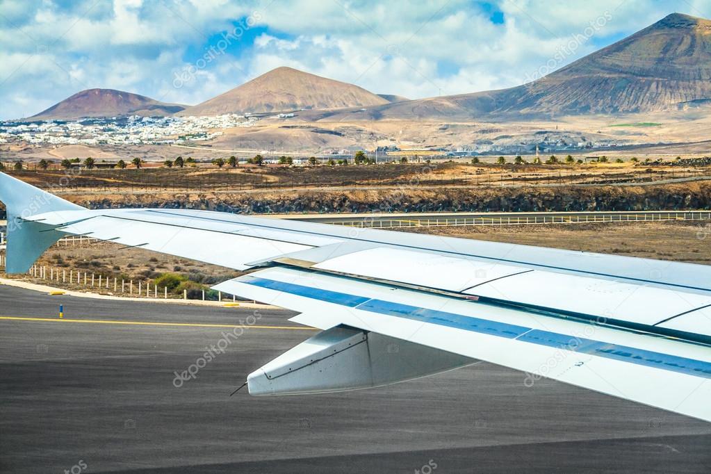 takeoff at airport of Lanzarote with volcanoes