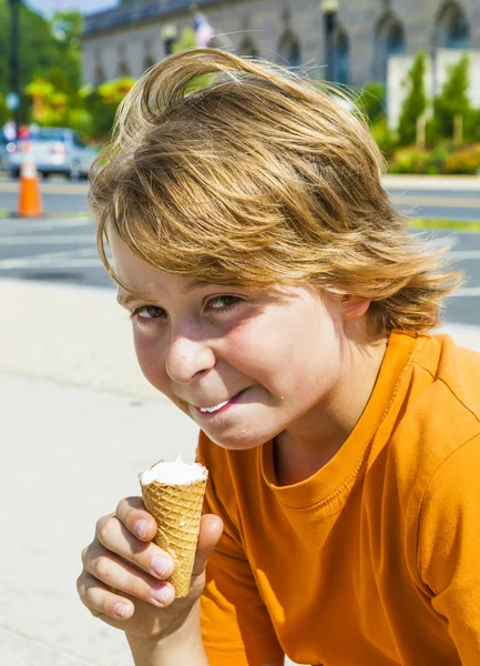 A young boy eating a tasty ice cream Royalty Free Stock Images