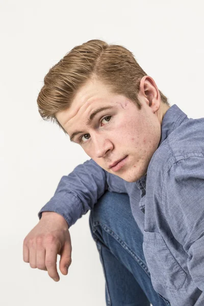 Cool boy with red hair posing in studio — Stock Photo, Image