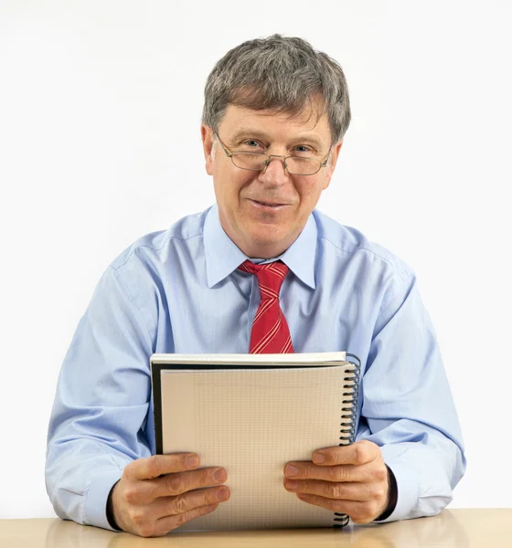 Business man reads in a diary — Stock Photo, Image