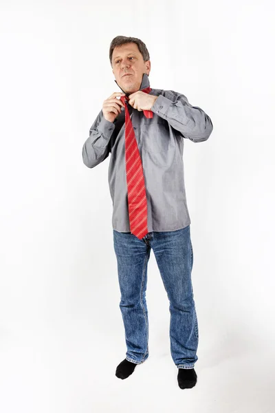 Business man binds his tie — Stock Photo, Image