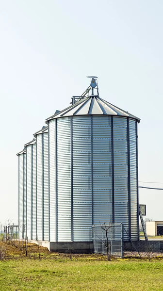 Silver silos in field — Stock Photo, Image