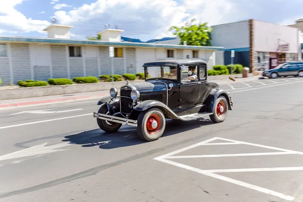 Ford vintage car driving through the streets — Stock Photo, Image