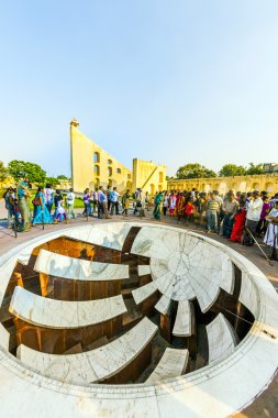 people visit astronomical instrument at Jantar Mantar observator clipart