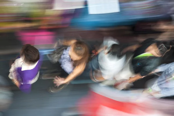 People in motion at the sidewalk — Stock Photo, Image