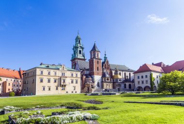 Wawel castle on sunny day with blue sky and white clouds clipart