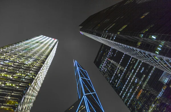 Facade of skyscrapers  by night — Stock Photo, Image