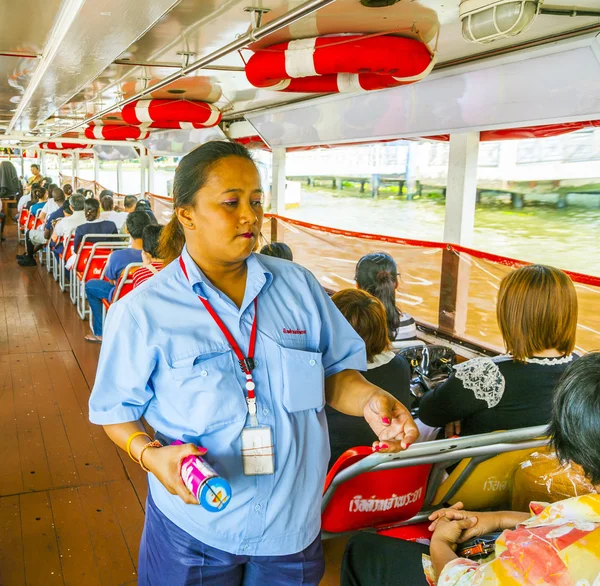 Lady in a boat sells tickets for public transportation at the fe — Stock Photo, Image